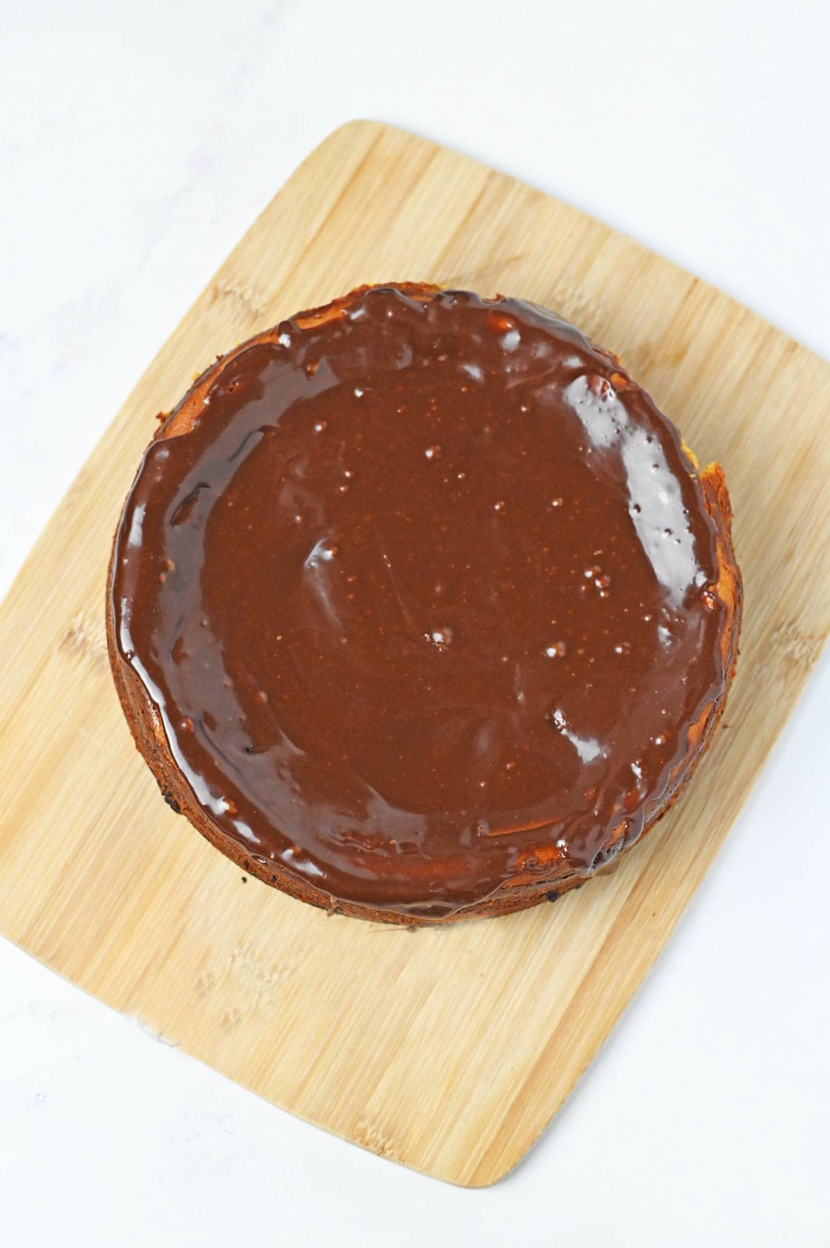 Cheesecake covered in chocolate ganache