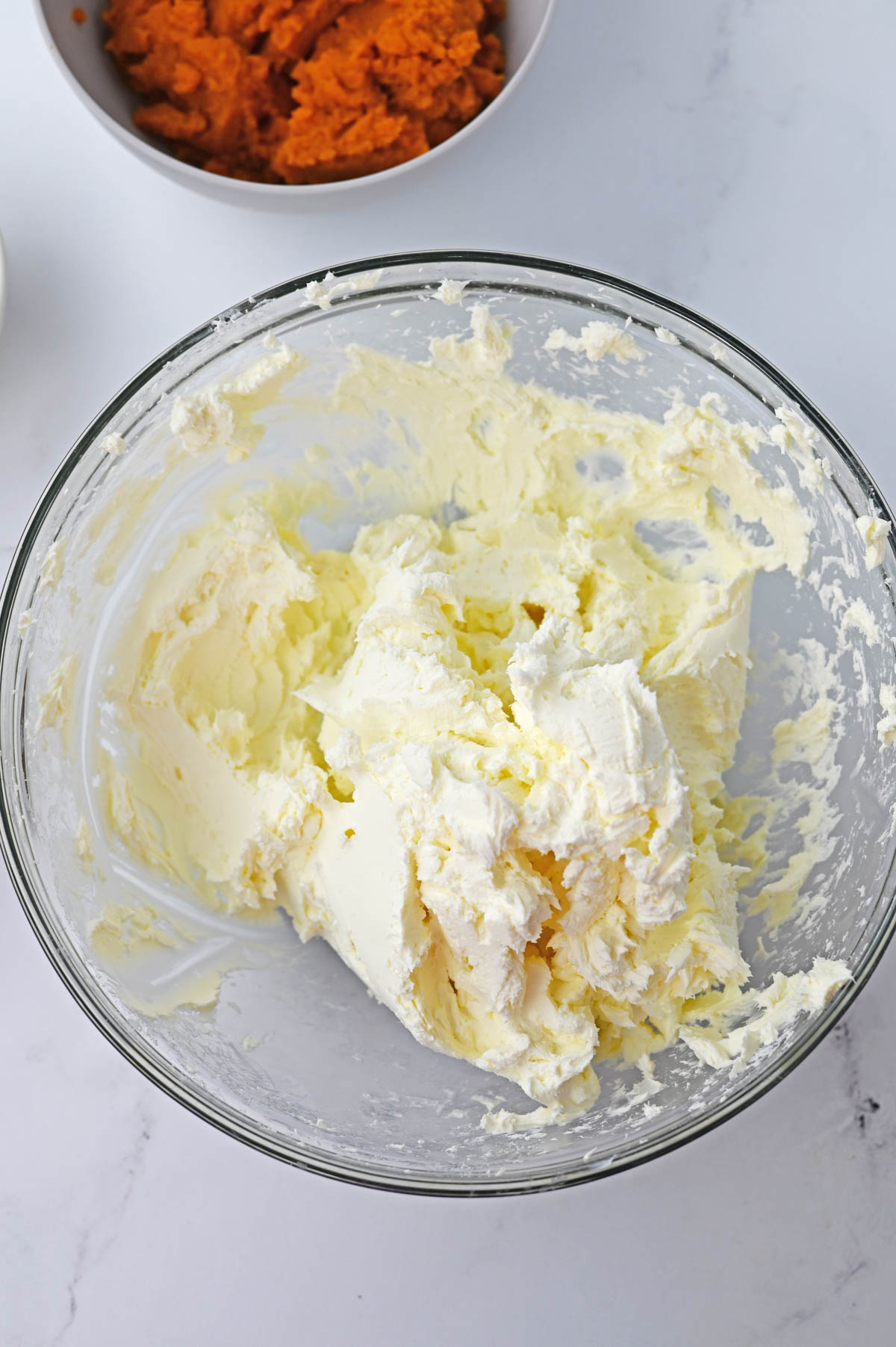 Cream cheese softened in glass bowl