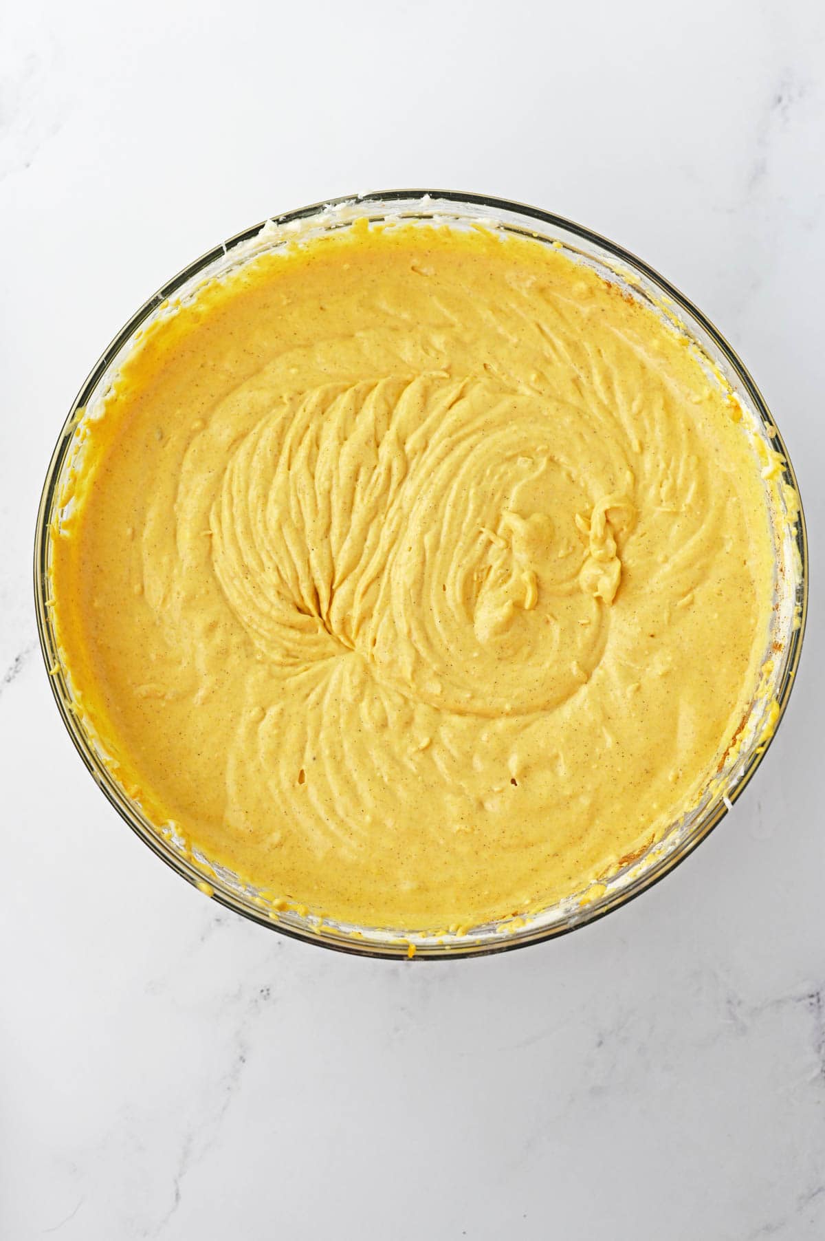 Cream cheese mixture with pumpkin puree, cream and spices in glass bowl
