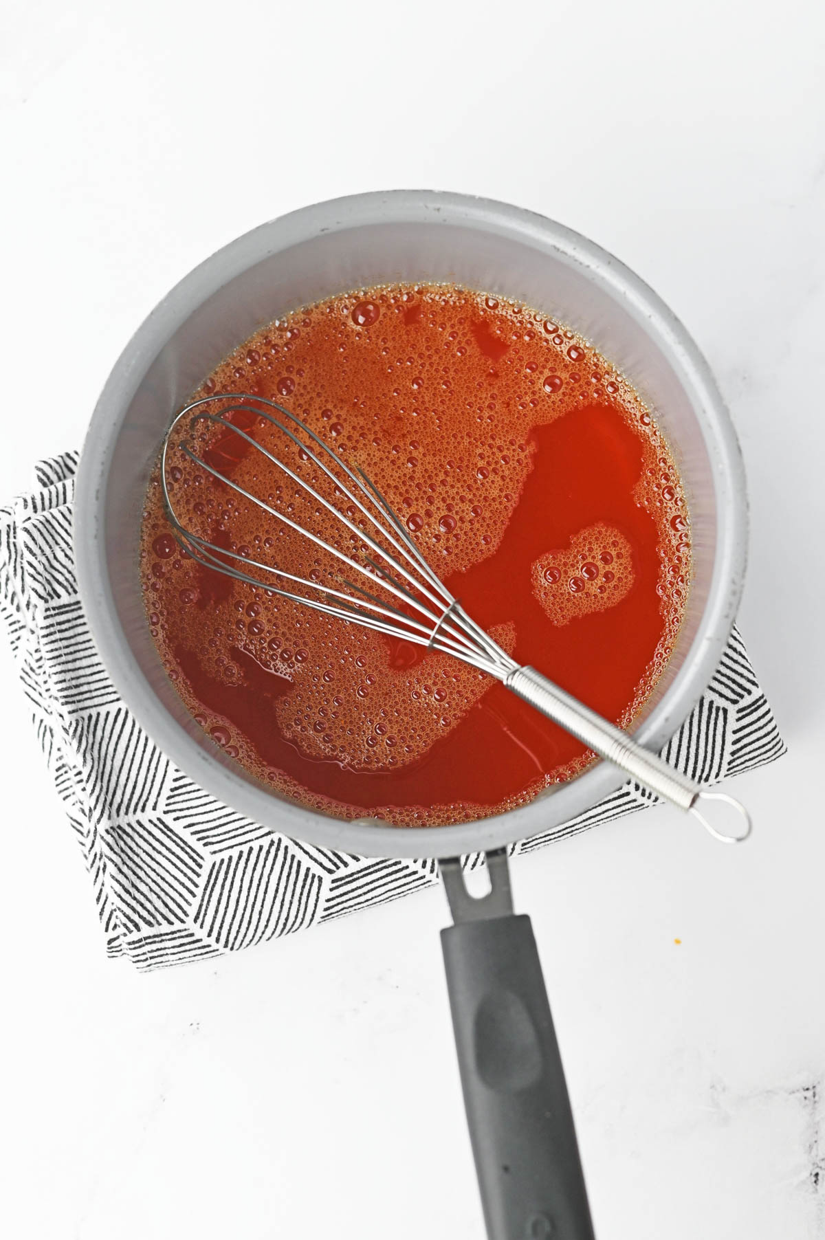Whisk in orange jello in saucepan