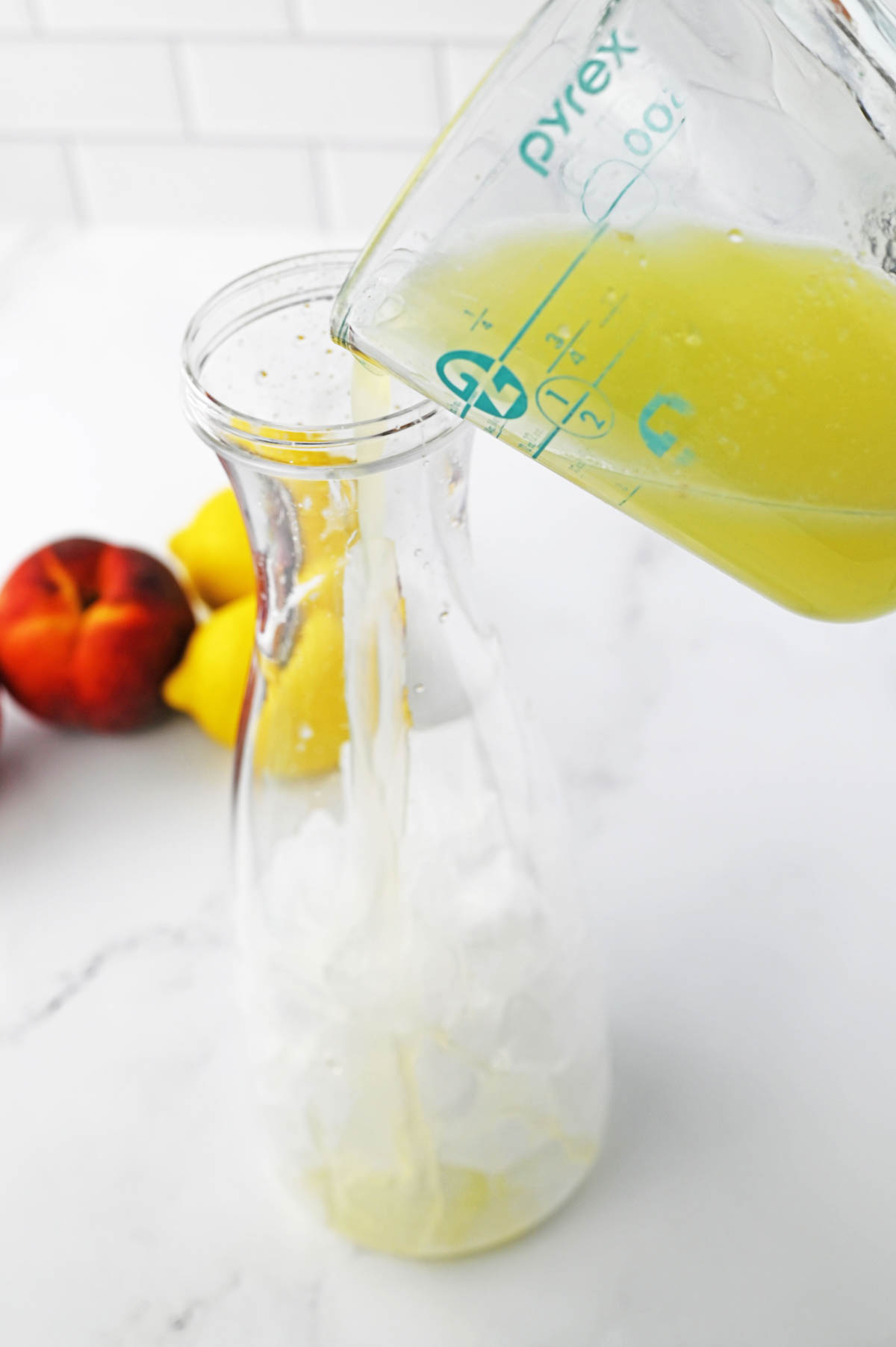 Pouring lemon juice into carafe