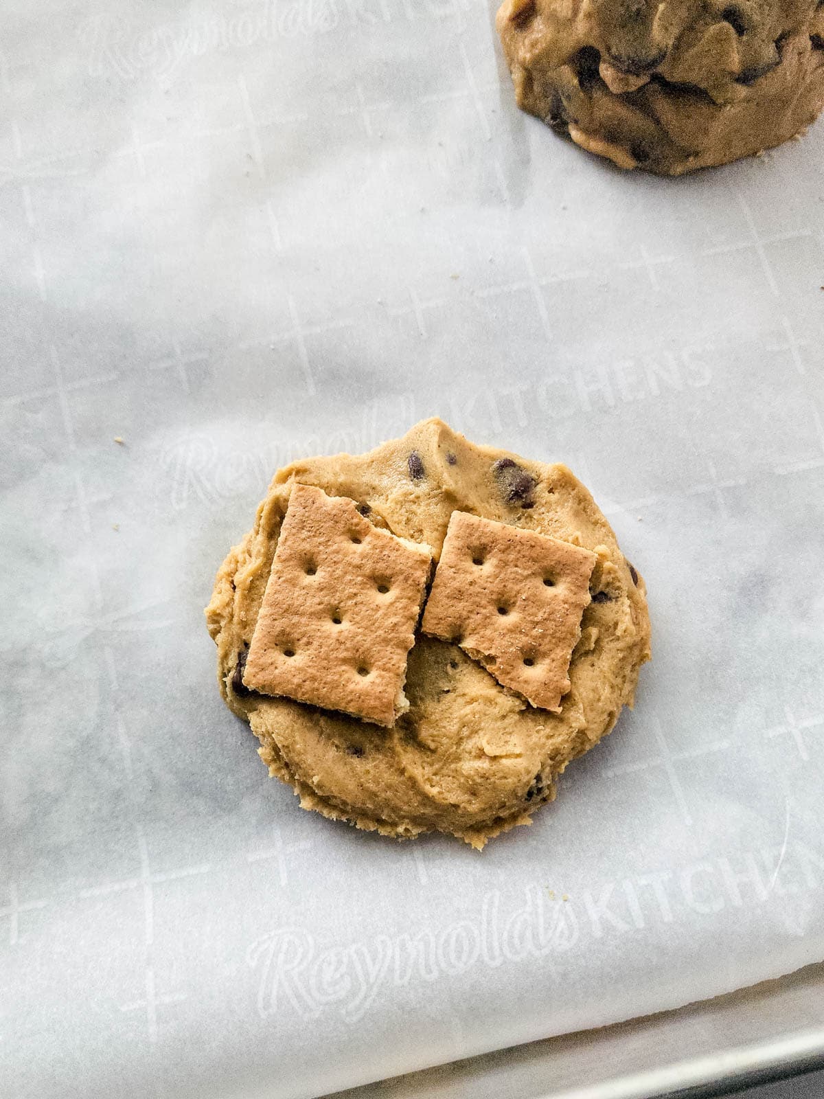Graham crackers on top of cookie dough