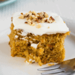 Pumpkin spice cake on white plate with fork