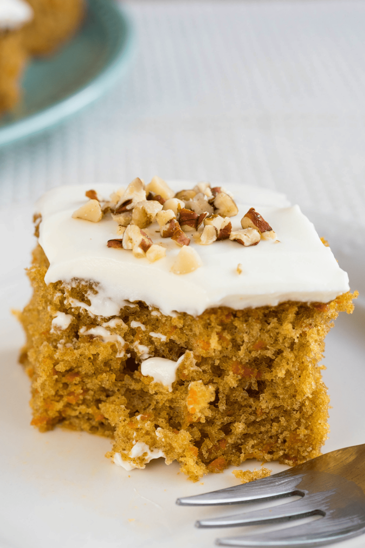 Pumpkin spice cake on white plate with fork