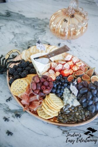 Halloween charcuterie board on marble counter