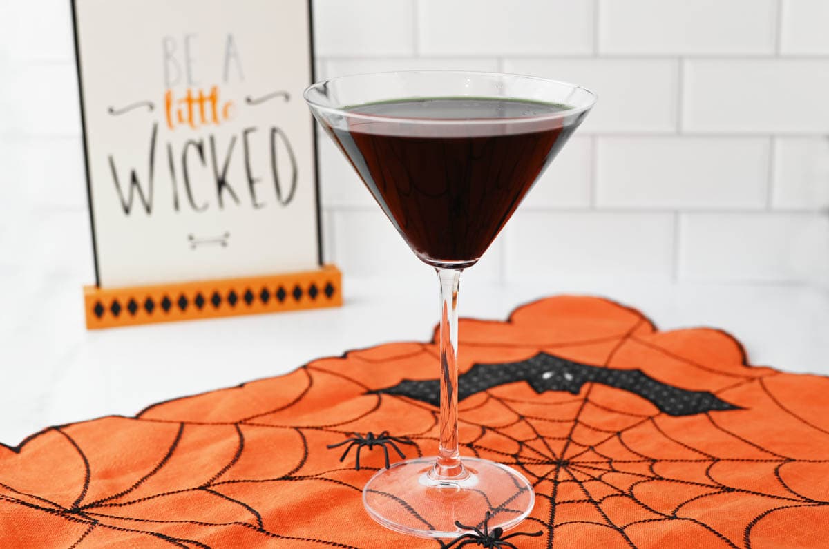 Black Martini in front of Be Wicked sign