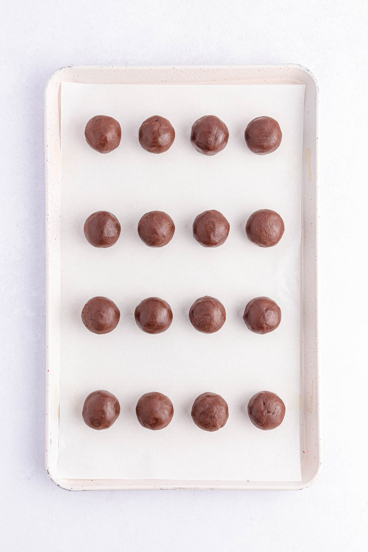 Brownie balls on baking sheet