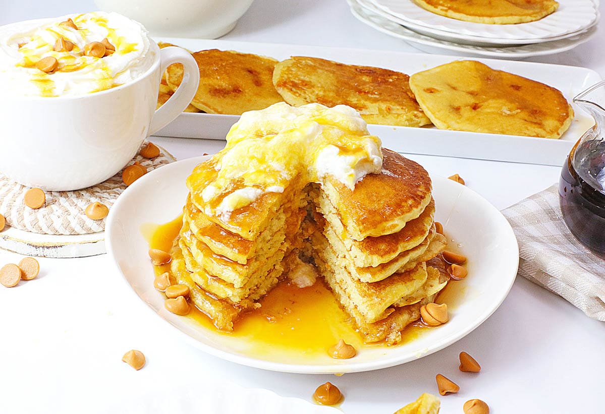 Butterbeer pancakes cut apart with whipped cream on top