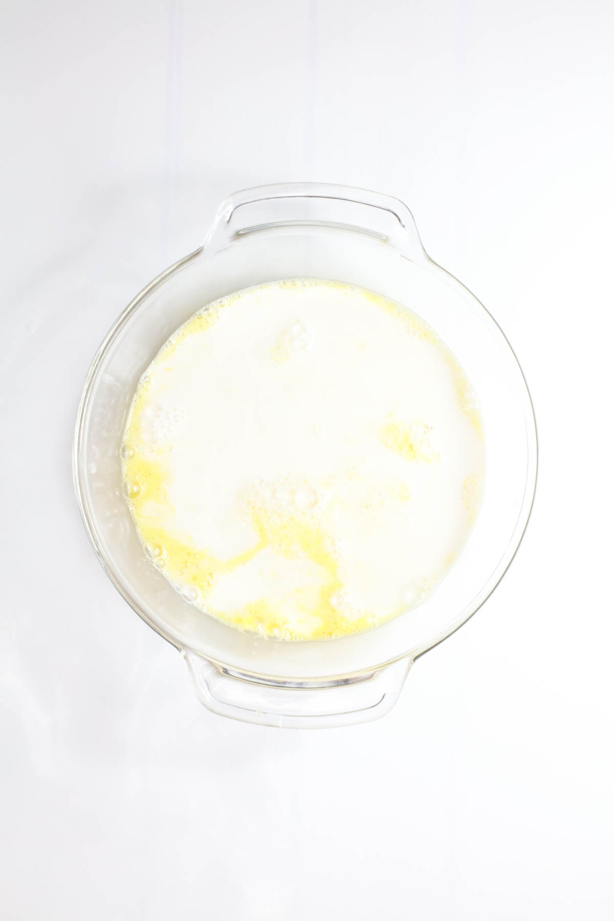 Egg mixture with milk in bowl