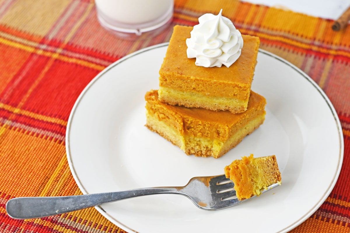 Pumpkin bars with a bite of bar on a fork
