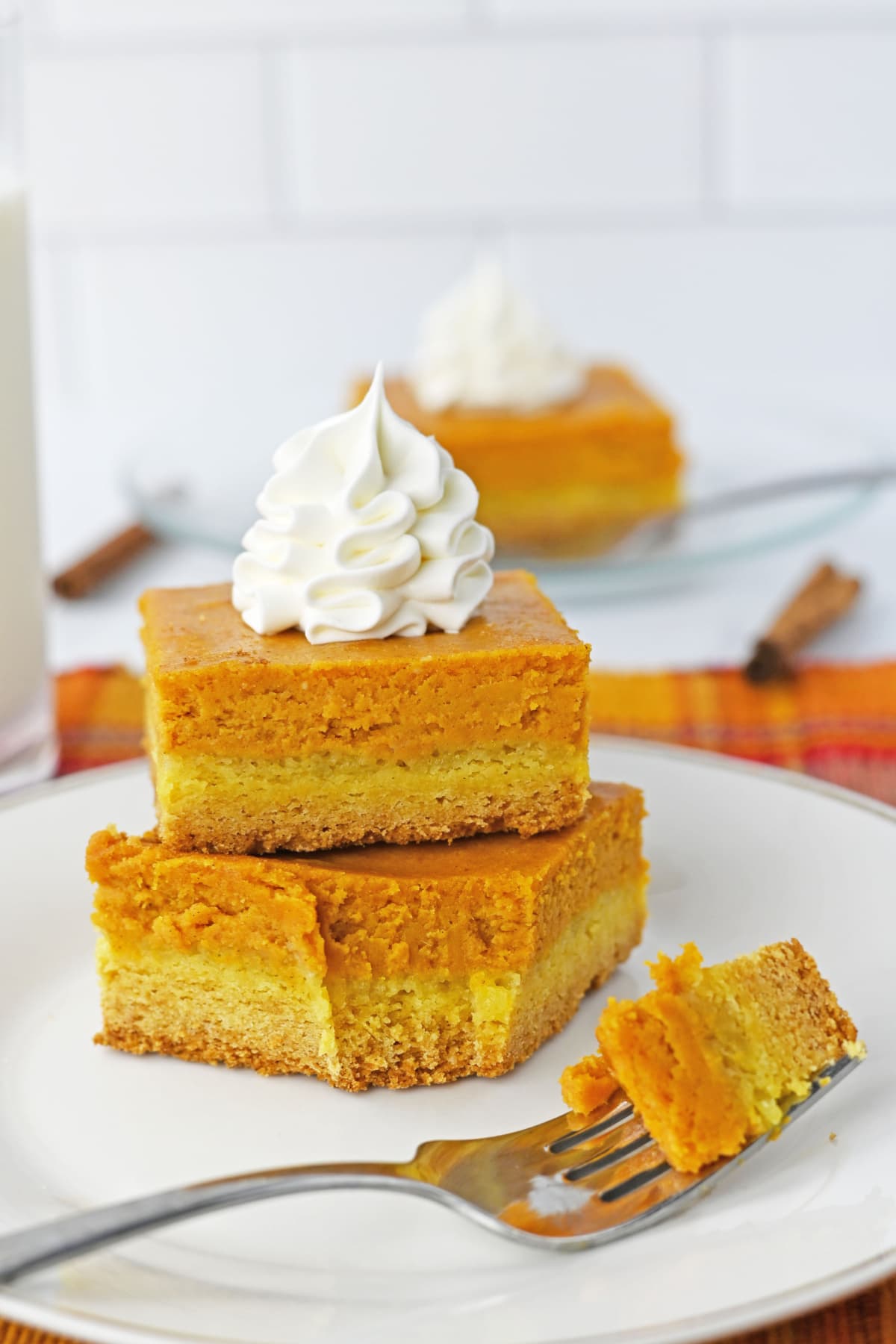 Cake mix pumpkin bars with a bite on fork