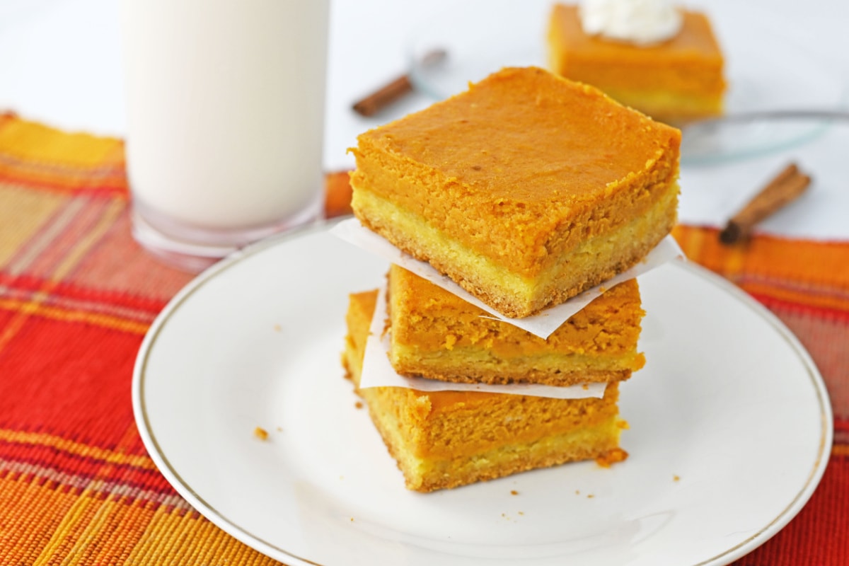 Pumpkin bars stacked on plate