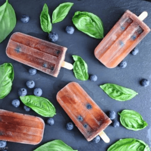 Chianti popsicles with berries and mint leaves