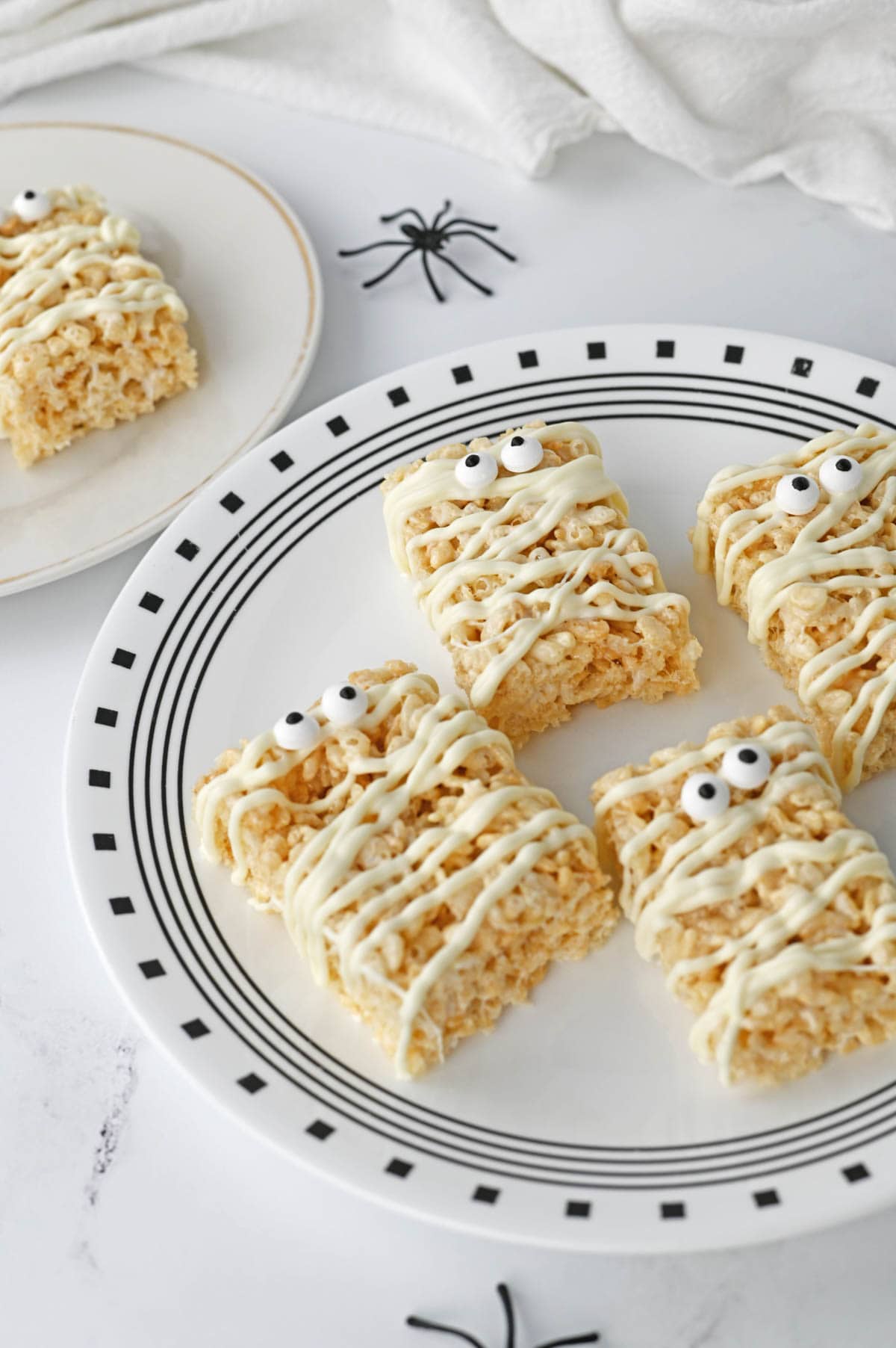 Halloween rice krispie treats with plastic spiders