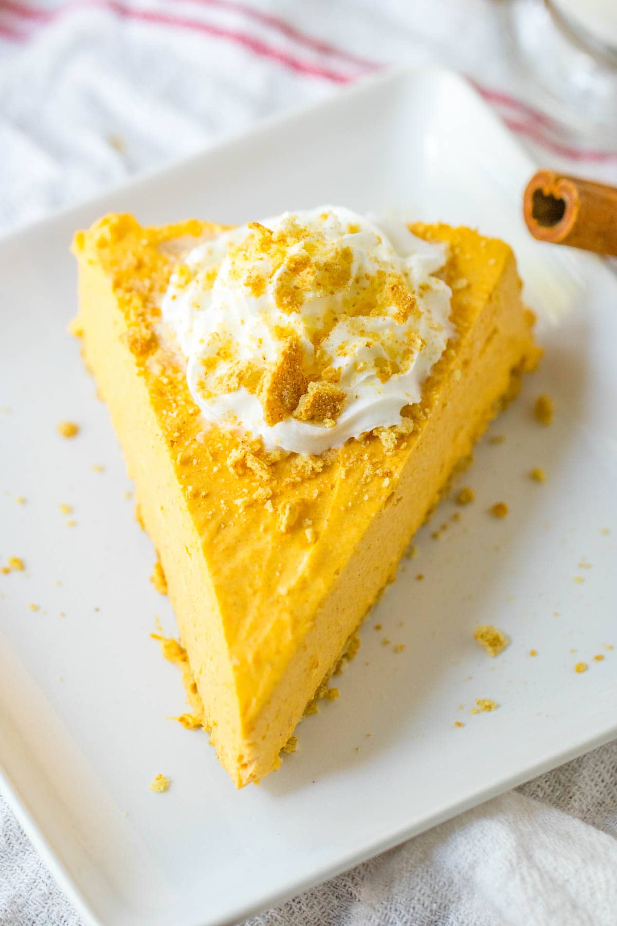 No bake pumpkin cheesecake topped with whipped cream