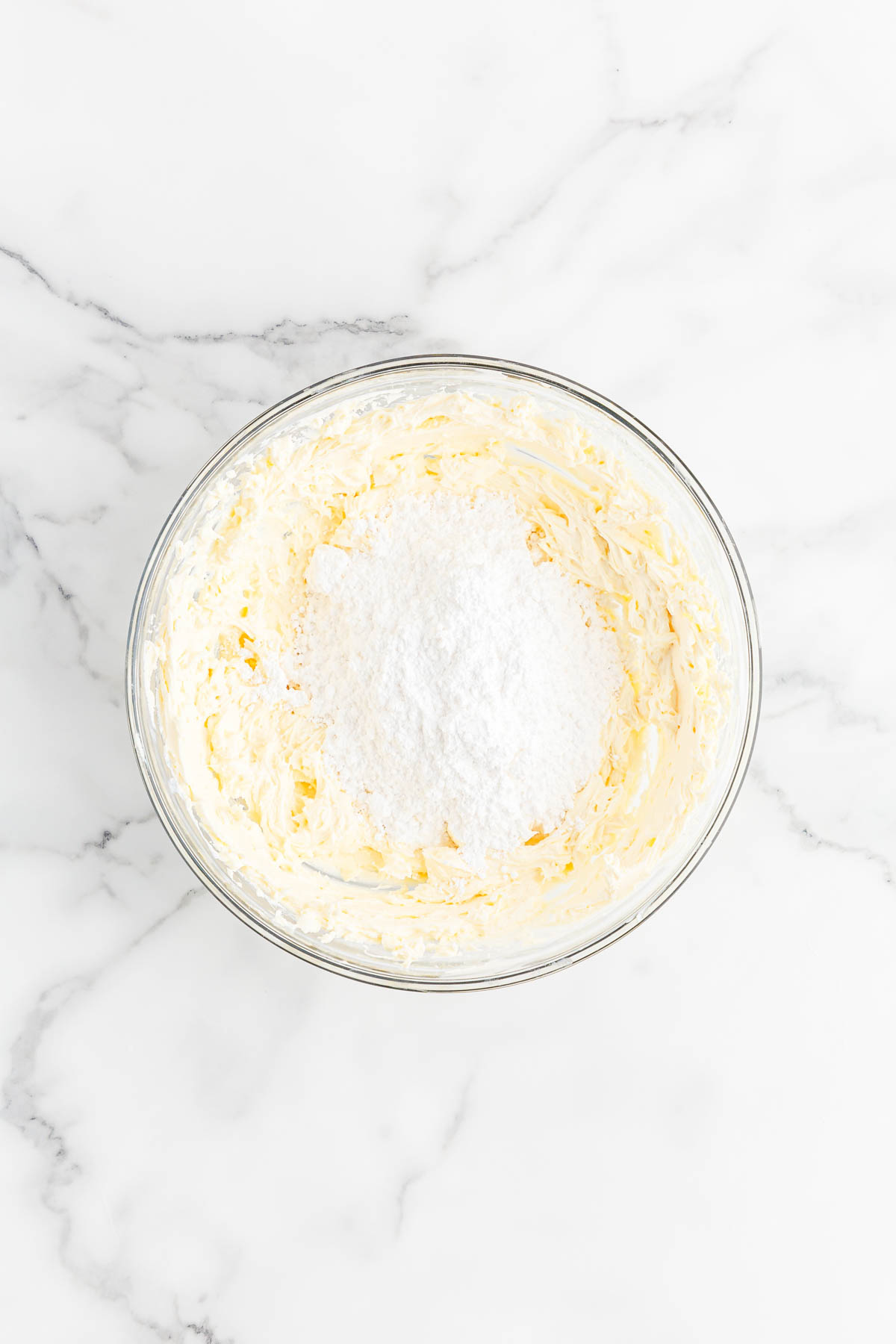 Powdered sugar in cream cheese mixture