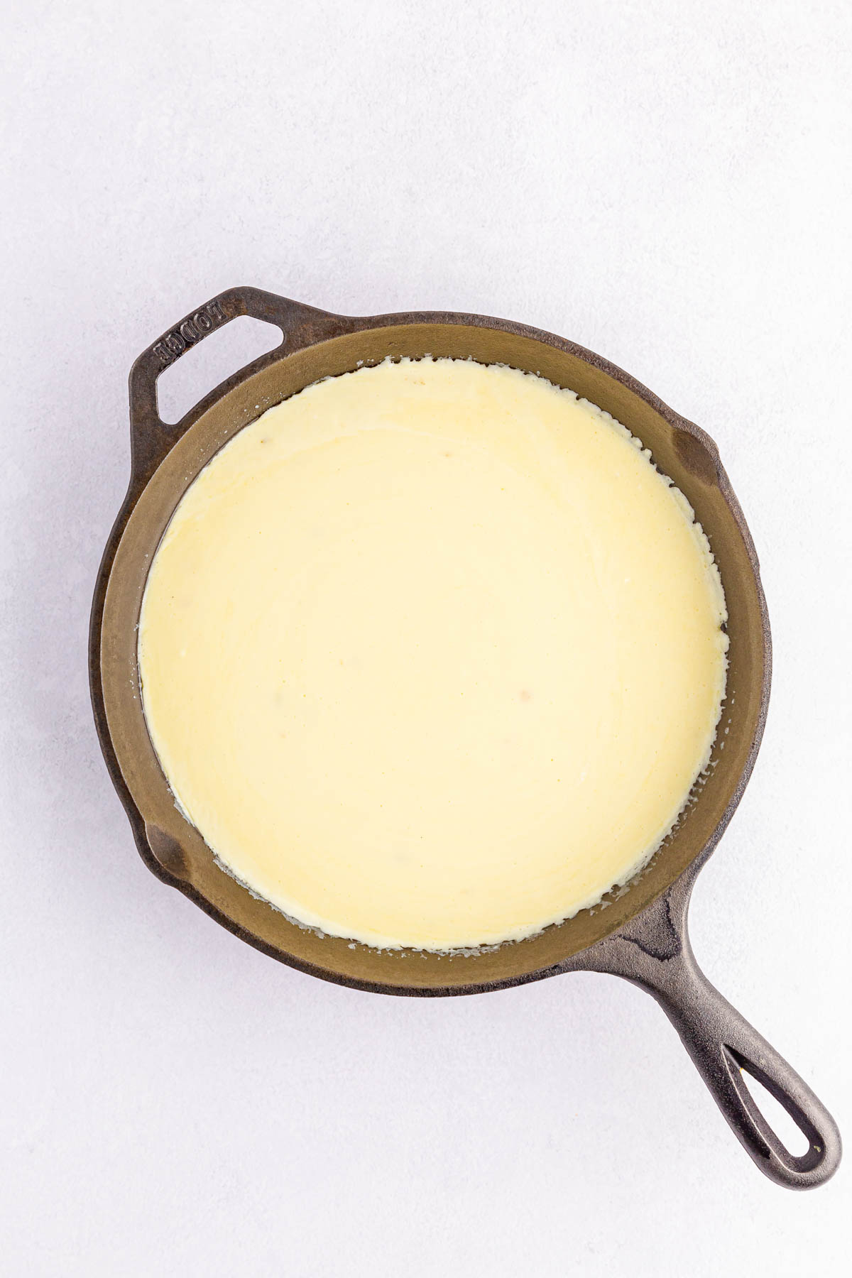 Melted cheese sauce in skillet
