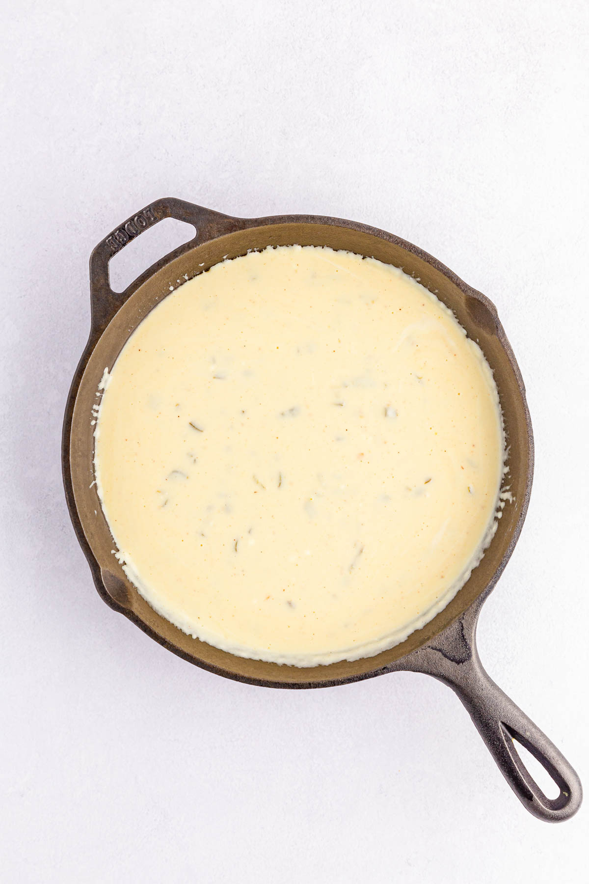 White queso dip in cast iron skillet