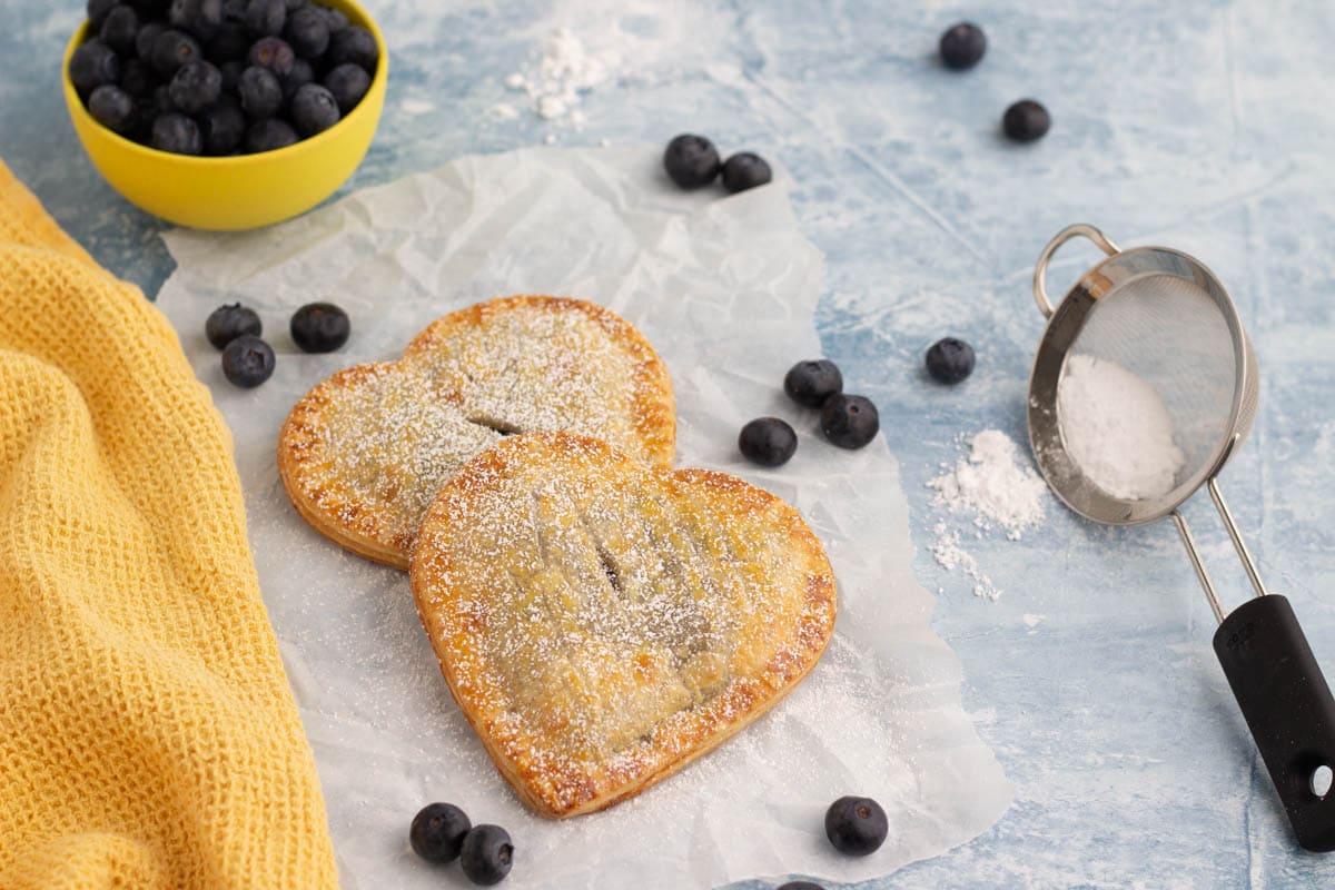 Blueberry hand pies with yellow towel
