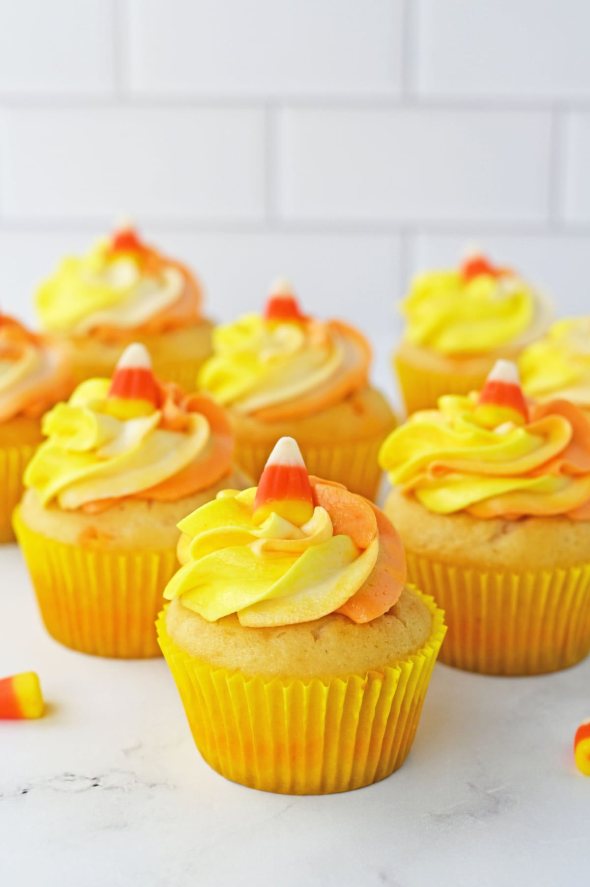 Candy corn cupcakes on white counter