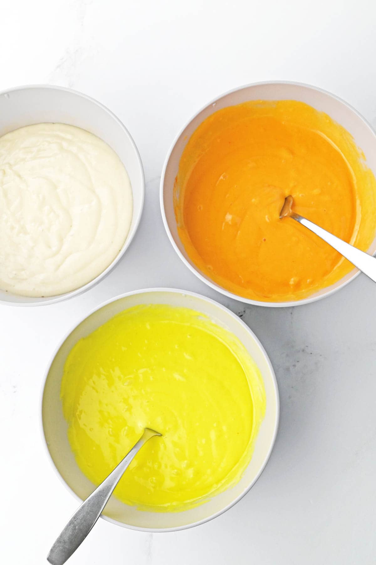 Cake batter with yellow and orange food coloring
