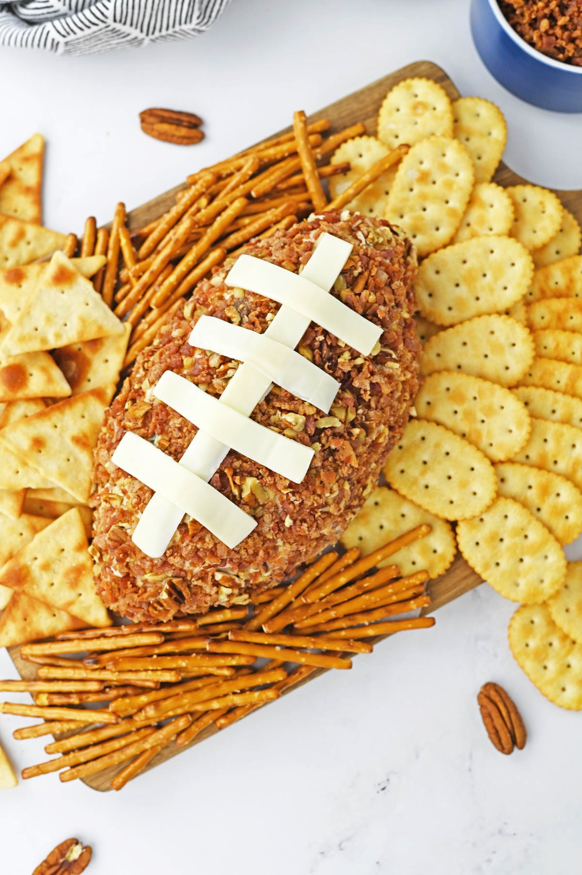 Cheese ball in the shape of football on platter