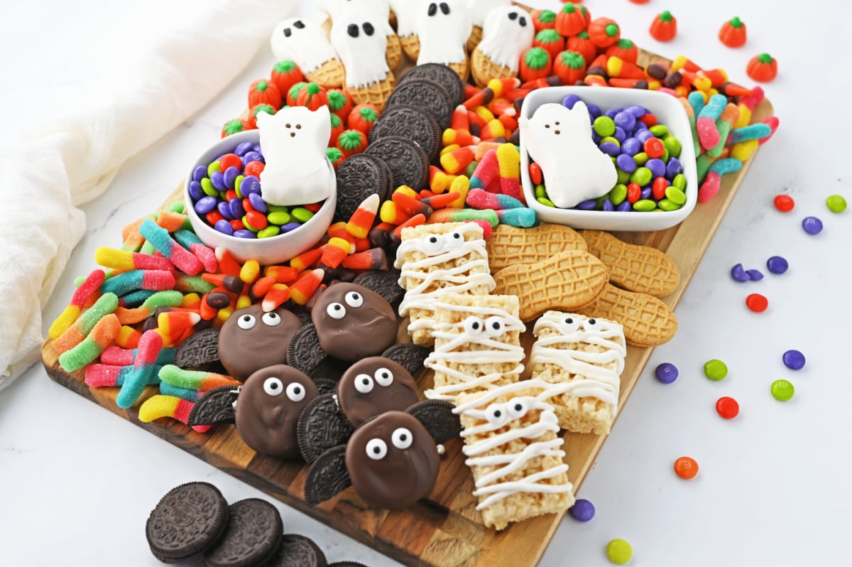 Halloween snack board with cookies and candy