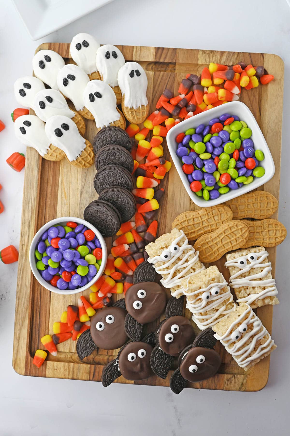 Candy board with cookie ghosts, Oreo bats and more