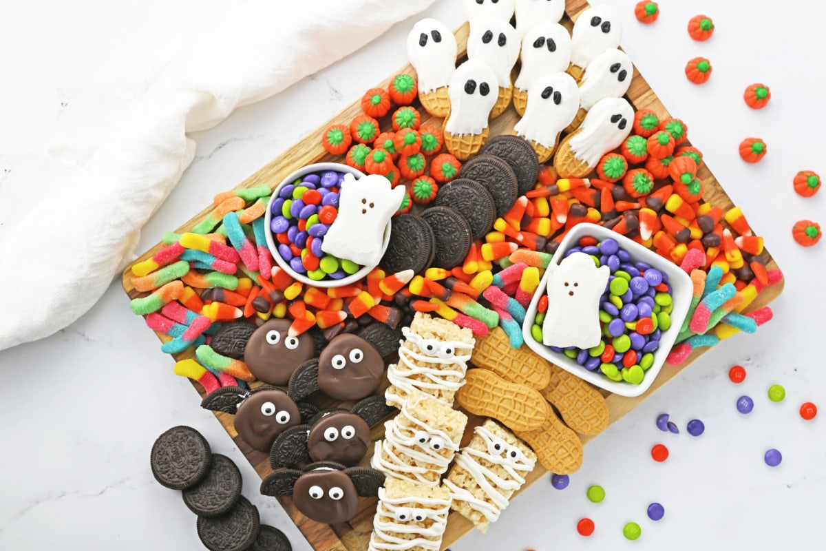 Halloween Snack Board with cookies and candy around it