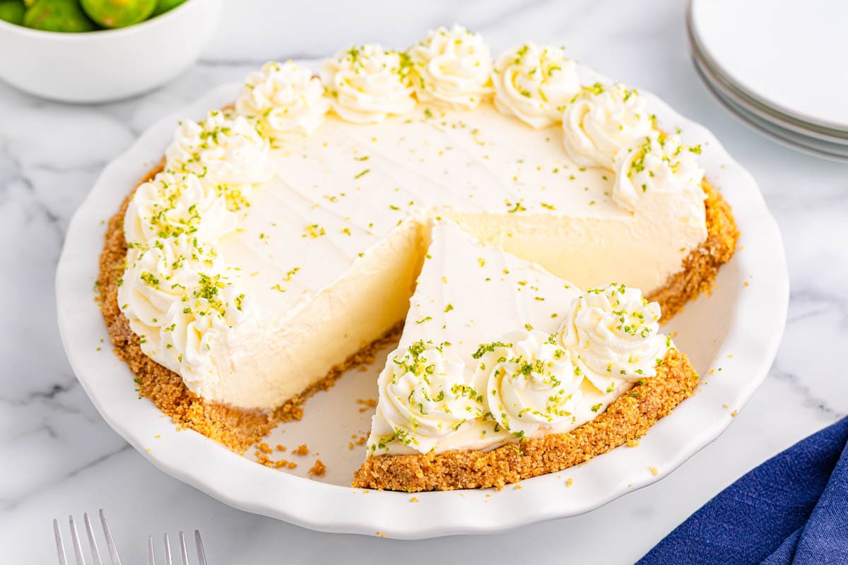 Key lime pie with a piece cut off