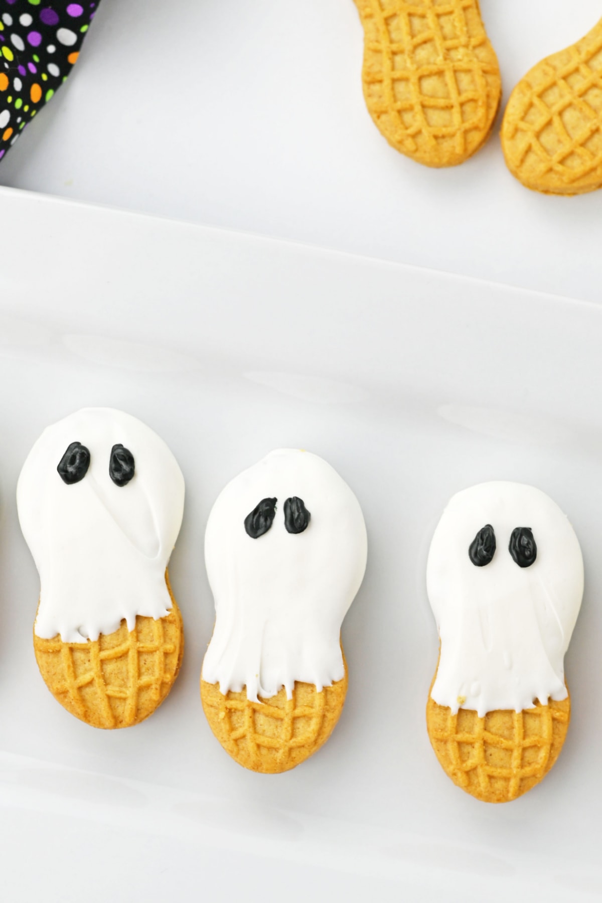 Three Nutter Butter Ghosts on white plate