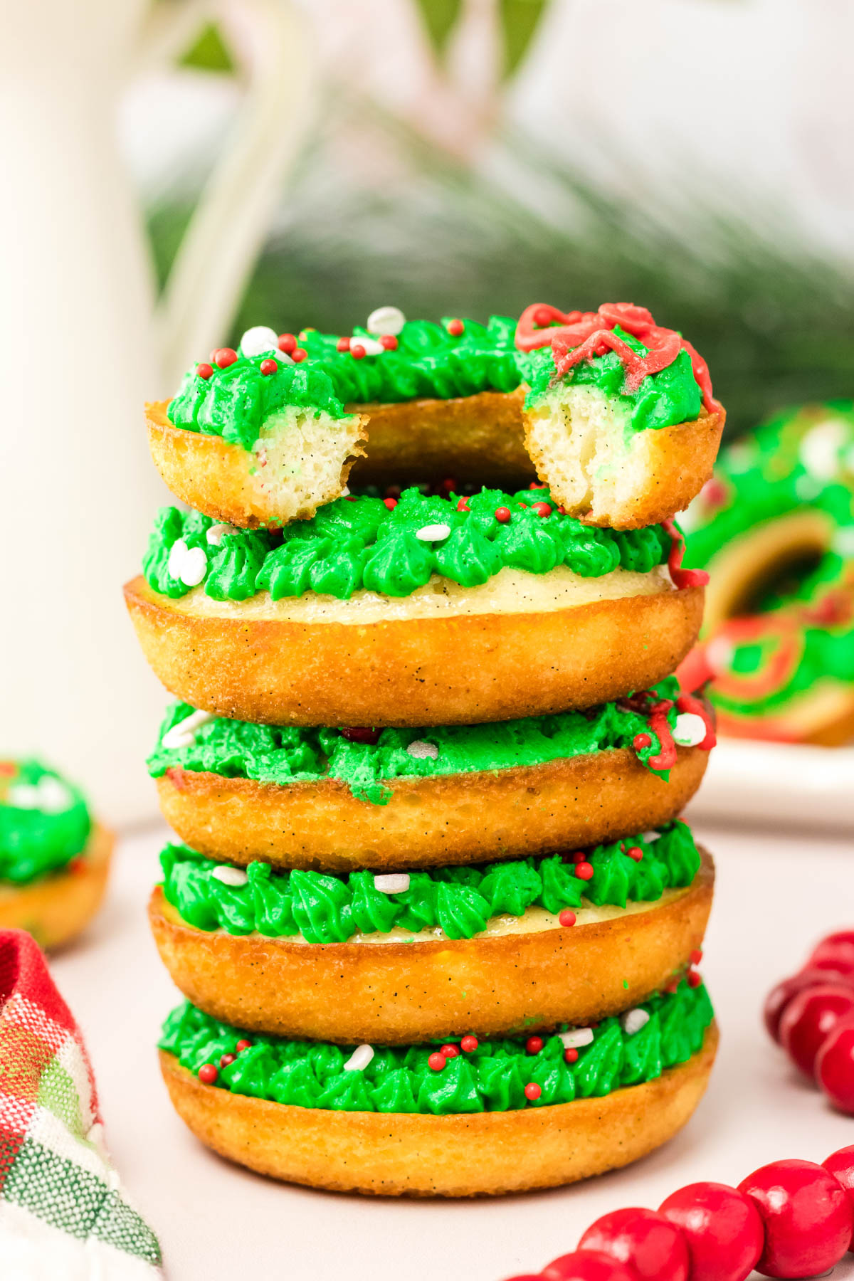 A stack of donuts with icing on top.