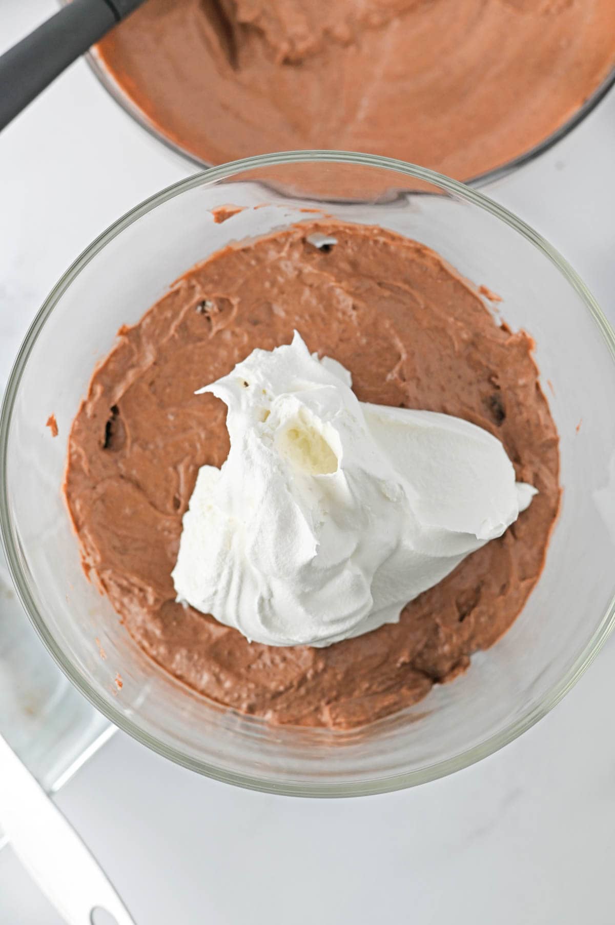 Chocolate pudding and cool whip layers for brownie trifle