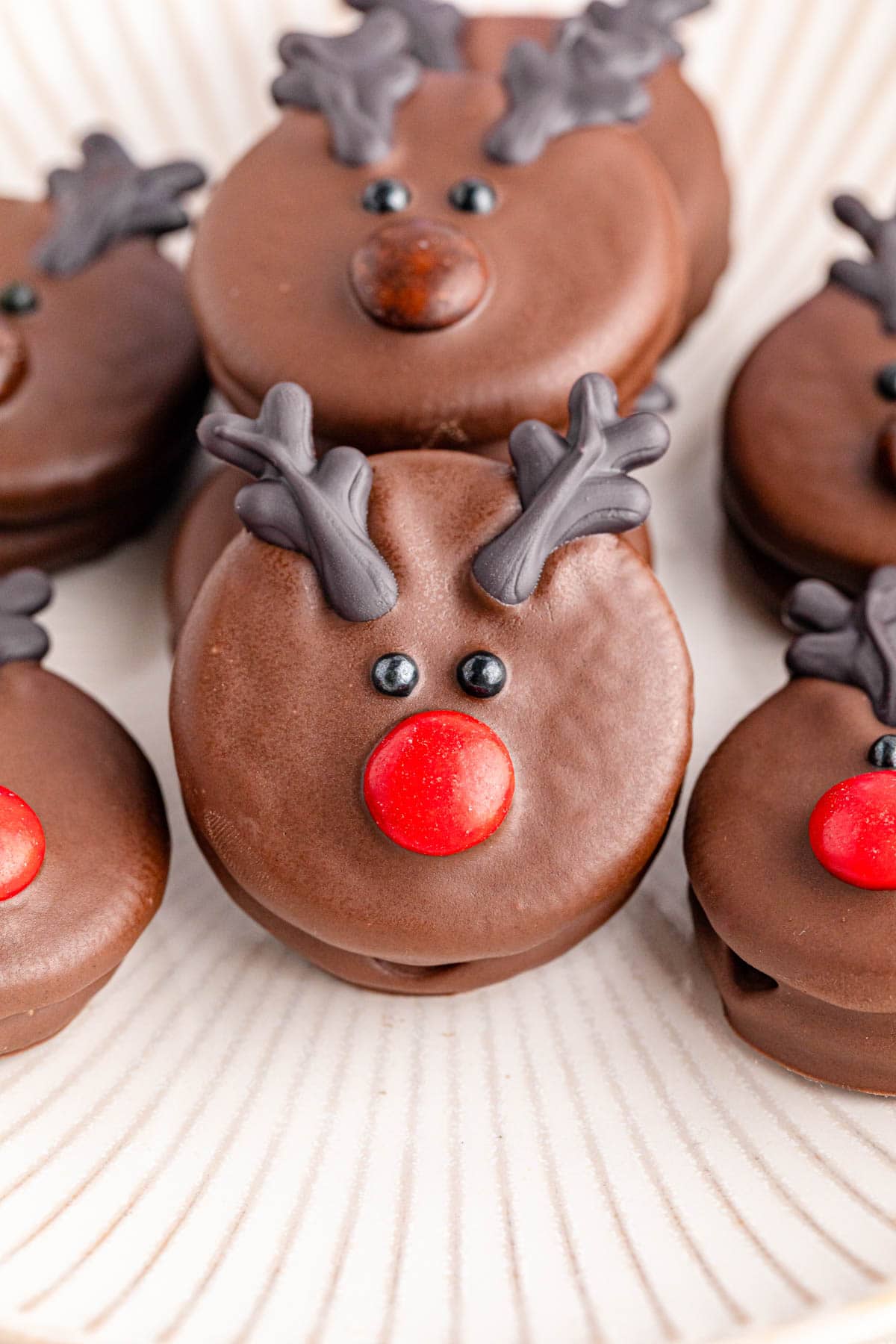 Chocolate reindeer cookies on a plate.