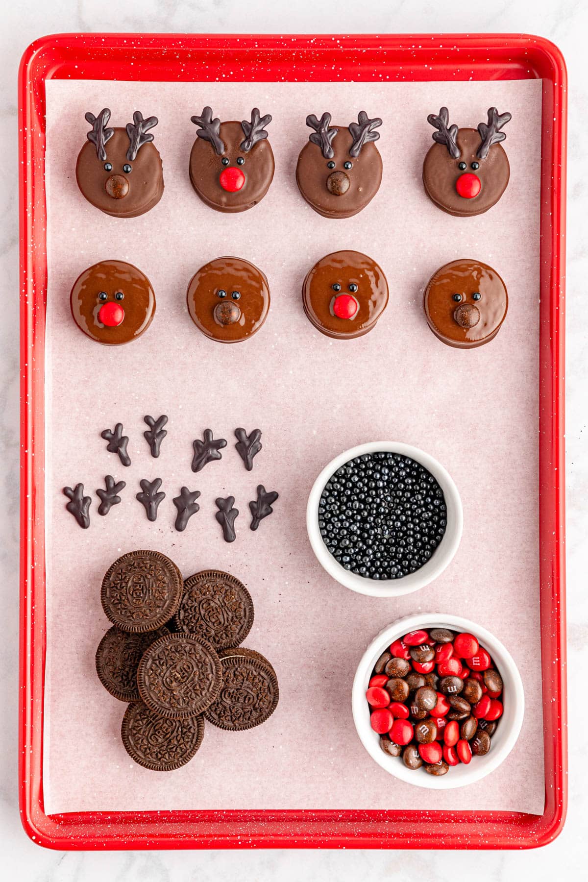 A tray of chocolate reindeer cookies and oreos.
