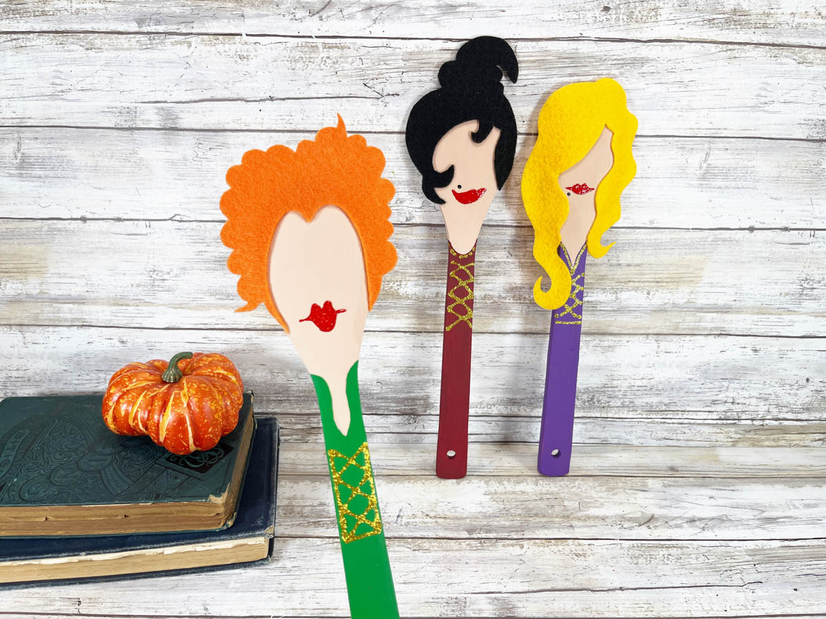 Three wooden spoons with Hocus Pocus witches on them.