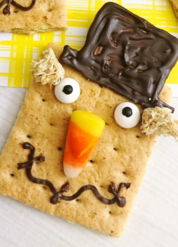 Graham crackers with a scarecrow face on them.