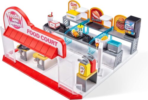 A toy fast food restaurant set with a toy car.