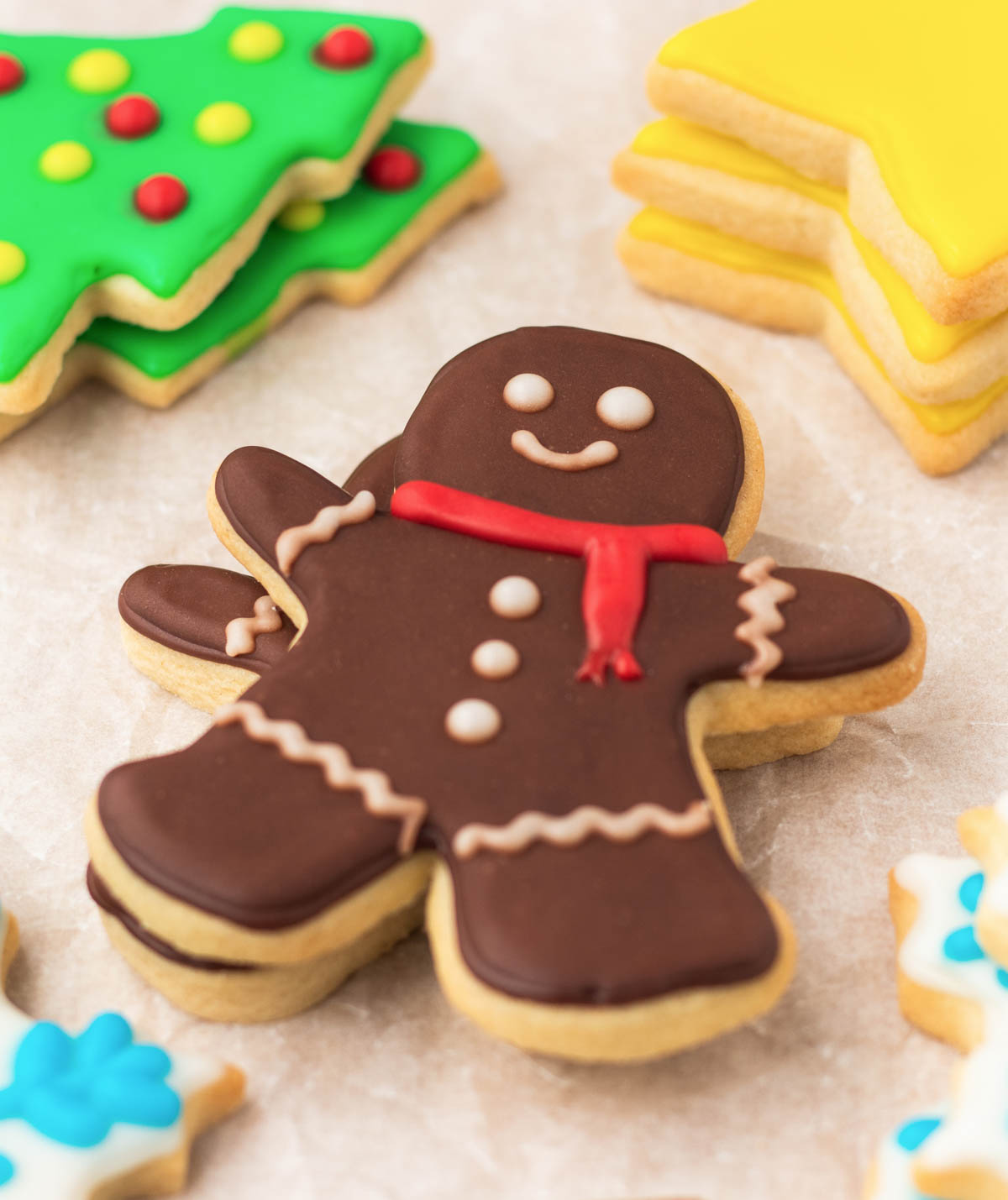 A group of gingerbread cookies with icing and decorations.