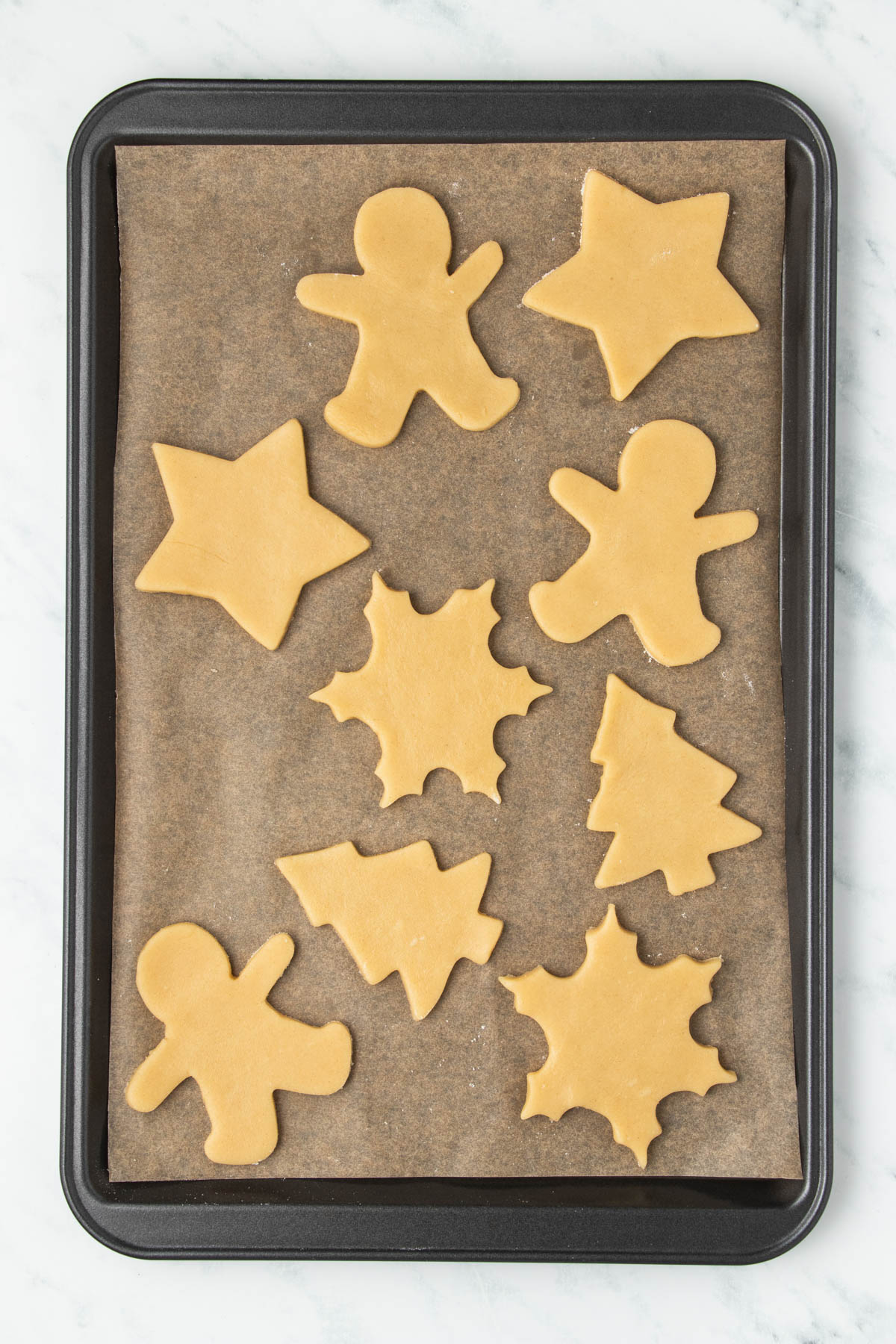 Gingerbread cookies on a baking sheet.