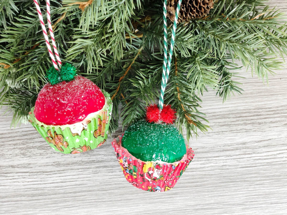 Christmas ornament cupcakes on fir branch
