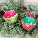 Christmas Cupcake Ornaments on tree branch with pine cones