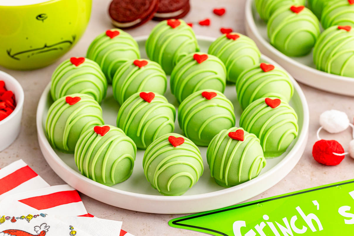 A plate of green Oreo balls with a heart on top.