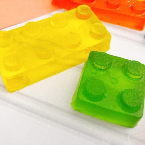 Lego brick soap bars on a white surface.