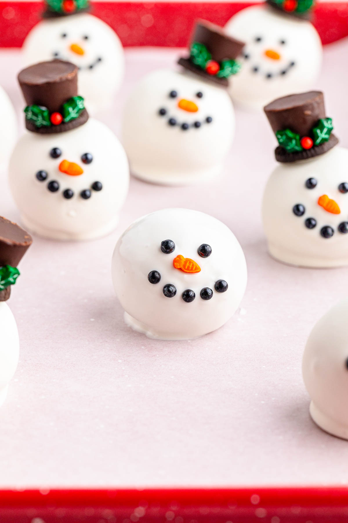 Snowman Oreo balls on a red tray