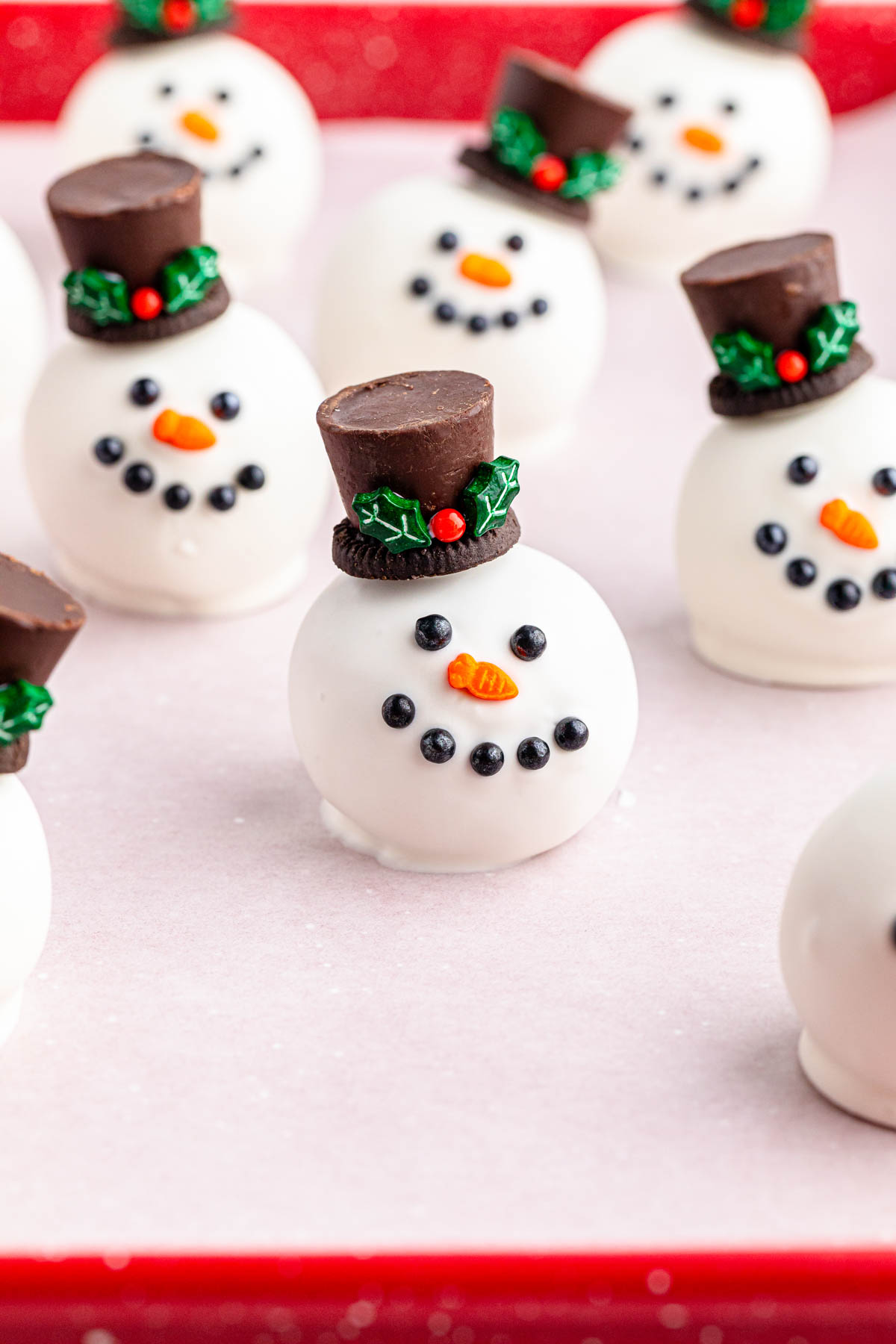 Oreo snowman balls on a red tray