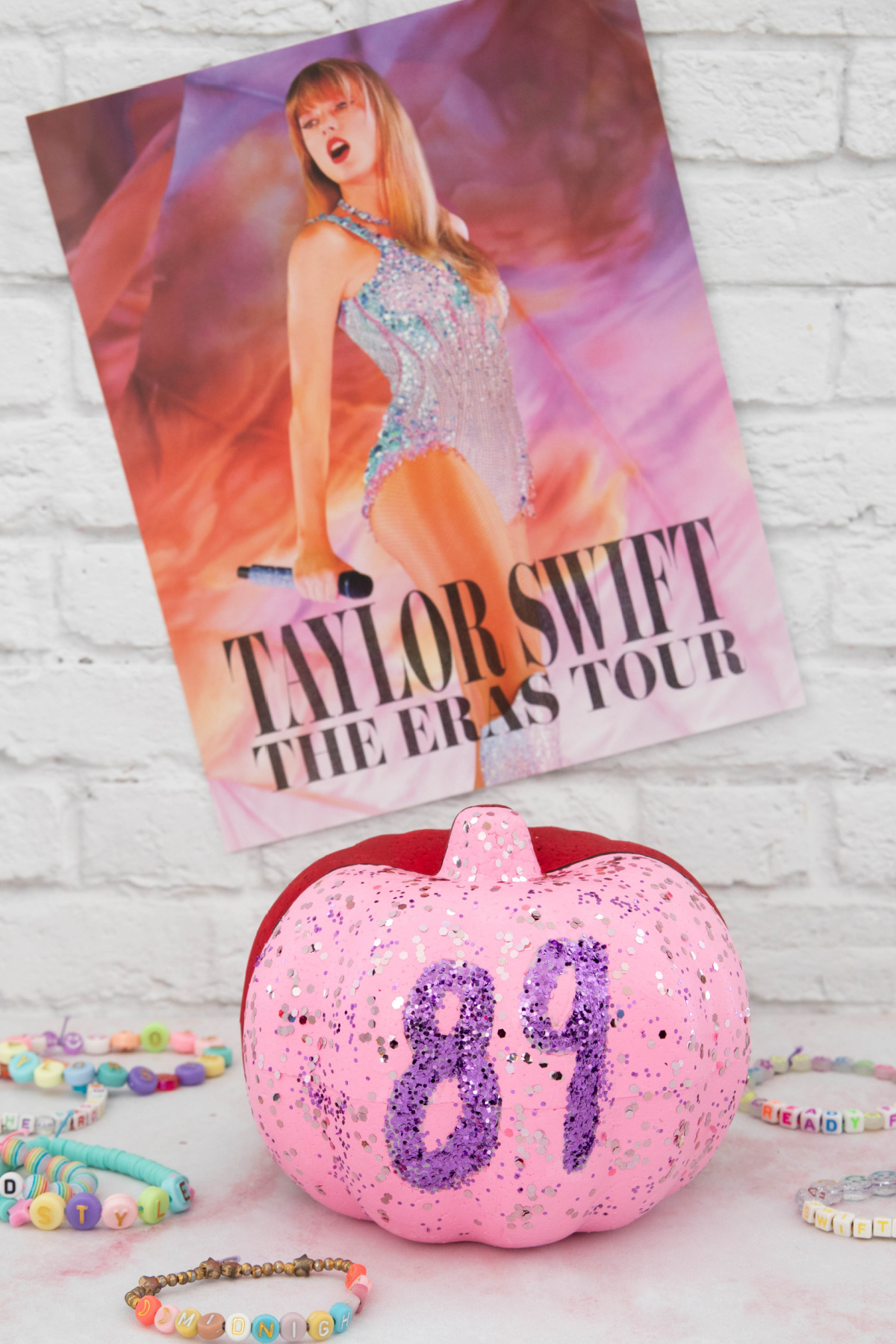 Pink Taylor Swift Pumpkin with Eras tour poster