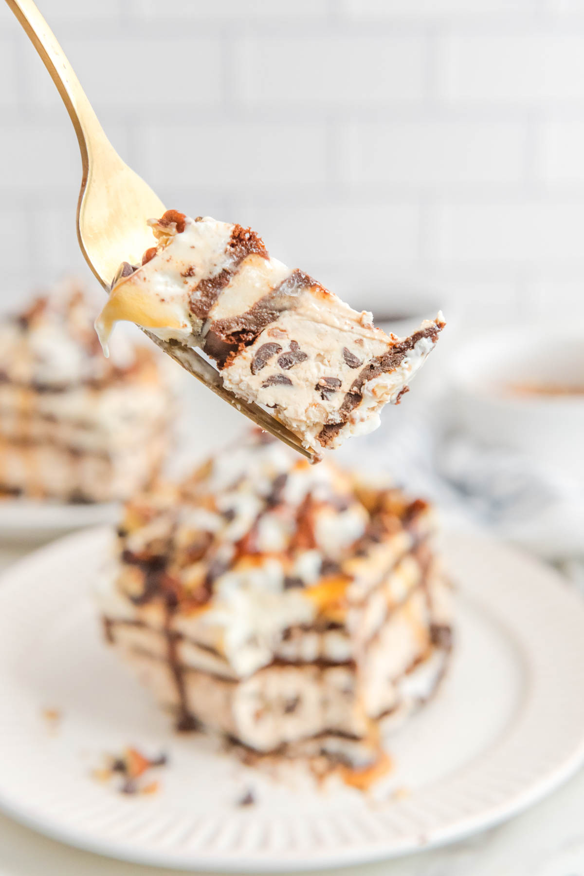 A piece of turtle ice cream cake on a fork