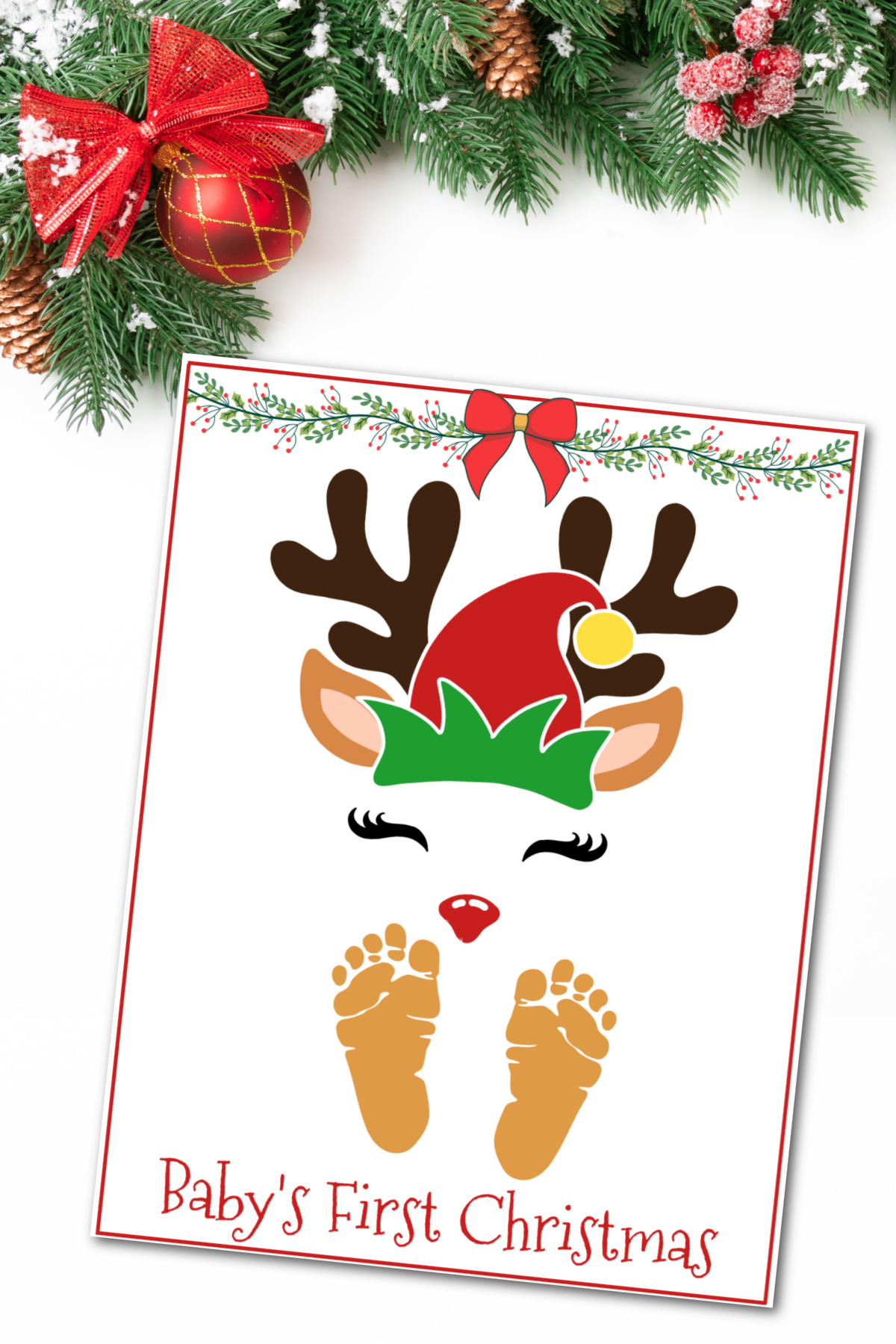 A baby's first christmas Reindeer art with baby feet