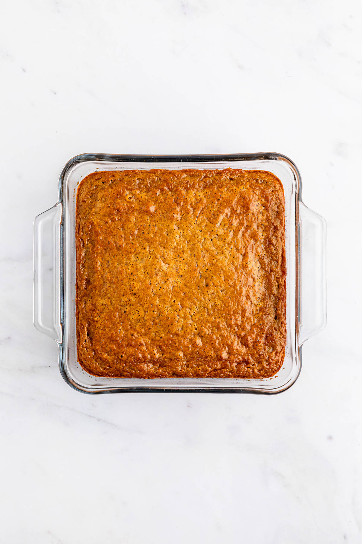Gingerbread cake in a glass baking dish.